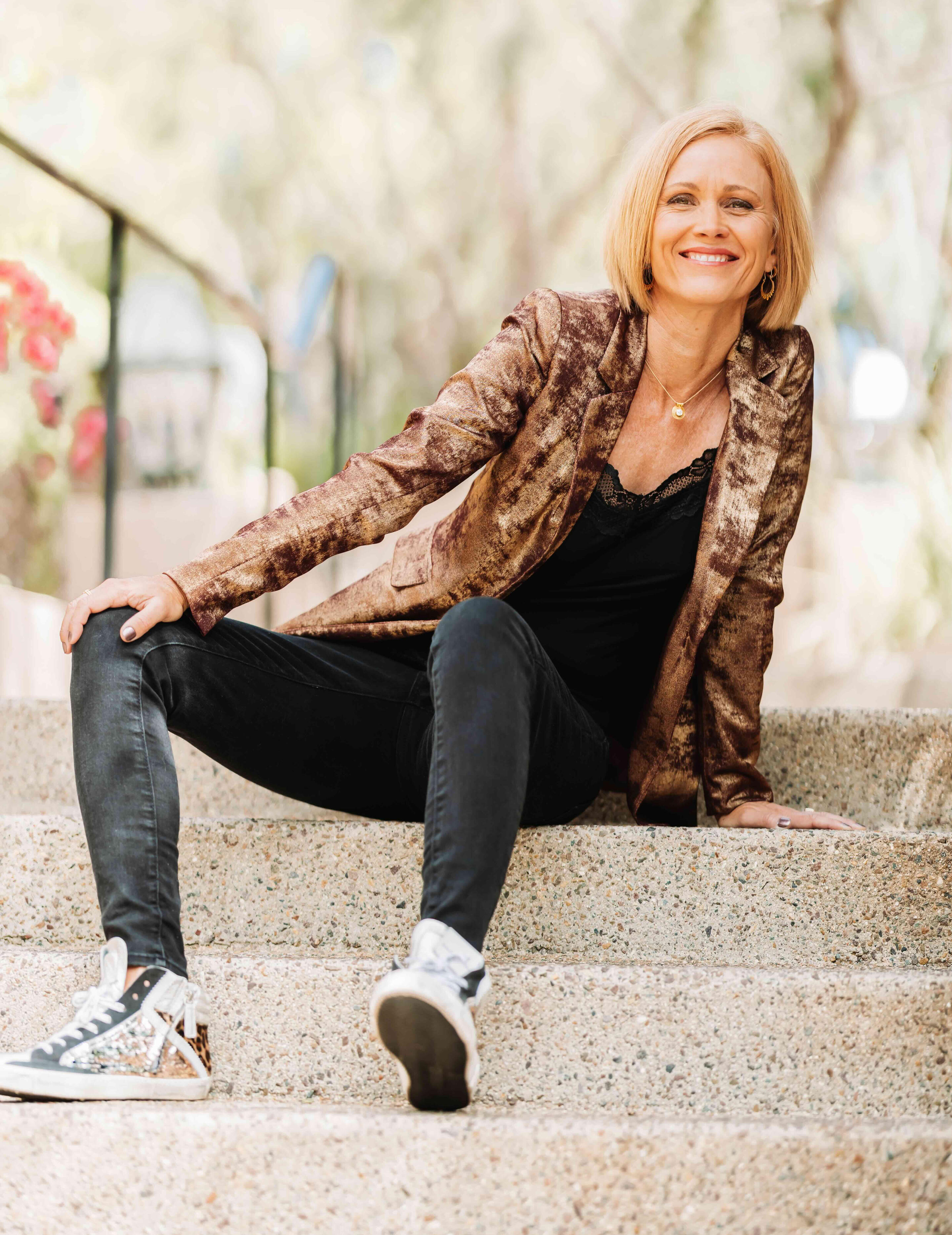 Kaia Alexander sitting on steps